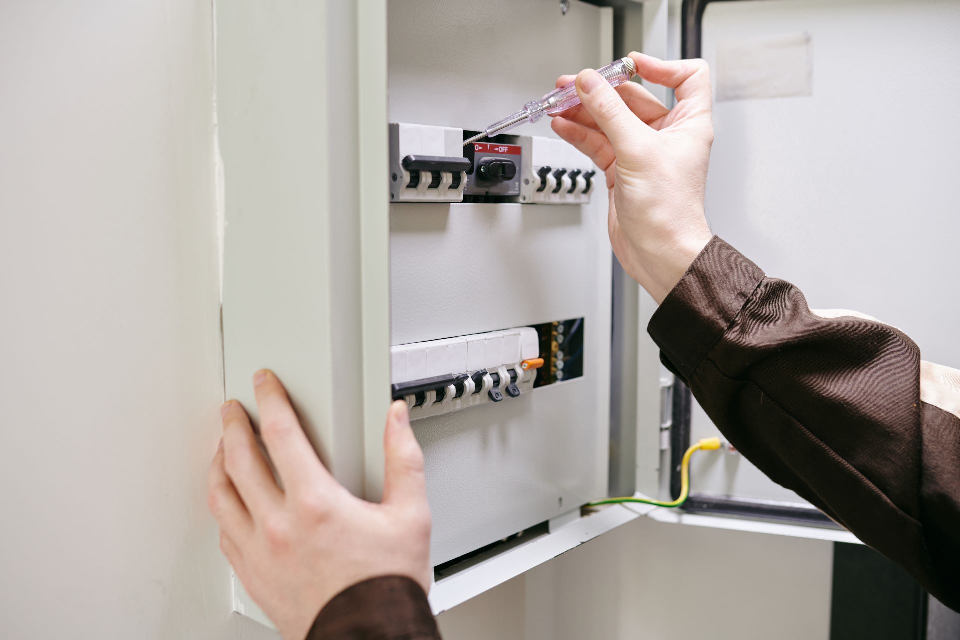 hands of young electrician using current measuring 2023 11 27 04 49 08 utc